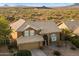 Two-story house with tile roof, desert landscaping, and mountain views at 4330 N Ranier Cir, Mesa, AZ 85215