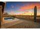 Relaxing pool area with a brick patio and stunning sunset backdrop at 4330 N Ranier Cir, Mesa, AZ 85215