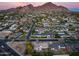 Aerial view of a charming house nestled in a neighborhood near a mountain backdrop at 4501 E Calle Redonda --, Phoenix, AZ 85018