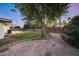 Backyard with mature trees and pathway at 4501 E Calle Redonda --, Phoenix, AZ 85018