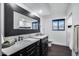 Bathroom with double vanity, marble tile, and large mirror at 4501 E Calle Redonda --, Phoenix, AZ 85018