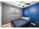 Bedroom featuring a ceiling fan and a large window to provide lots of natural light at 480 E Bart Dr, Chandler, AZ 85225