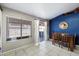 Bright dining area with tile floors, sliding glass doors, and a stylish accent wall at 480 E Bart Dr, Chandler, AZ 85225