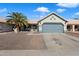 Charming single-story home featuring a low maintenance front yard, mature palm tree, and two-car garage at 480 E Bart Dr, Chandler, AZ 85225