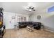 Cozy living room showcasing a large sectional sofa, ceiling fan, and neutral decor at 480 E Bart Dr, Chandler, AZ 85225