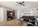 Open living room with tile floor and large media center and view of the front door at 480 E Bart Dr, Chandler, AZ 85225