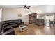 Bright living room with a sectional sofa, wood accent wall, and view of dining area at 480 E Bart Dr, Chandler, AZ 85225