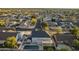 Daytime aerial view of a two story gray home with a blue backyard pool at 5344 E Catalina Ave, Mesa, AZ 85206