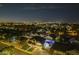 Night aerial view of home with a backyard pool and lush green lawn at 5344 E Catalina Ave, Mesa, AZ 85206