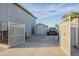 A gray shed sits in the backyard between a car and a white gate at 5344 E Catalina Ave, Mesa, AZ 85206