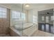 Bathroom boasting a large tub, tiled floors, and natural light from a window at 5344 E Catalina Ave, Mesa, AZ 85206