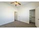 Cozy bedroom with a ceiling fan, closet and ample natural light, creating a serene and inviting space to rest at 5344 E Catalina Ave, Mesa, AZ 85206