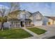 Charming two-story home with a covered front porch and well-manicured lawn at 5344 E Catalina Ave, Mesa, AZ 85206