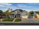 Charming two-story home with manicured lawn and covered front porch at 5344 E Catalina Ave, Mesa, AZ 85206