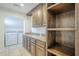 Well-organized laundry room features ample storage and modern appliances at 5344 E Catalina Ave, Mesa, AZ 85206