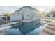 Backyard features a refreshing pool, patio, and a glimpse of the home's exterior at 5344 E Catalina Ave, Mesa, AZ 85206