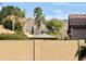 View of the backyard featuring desert landscaping, block wall and shade structure at 5612 W Alyssa Ln, Phoenix, AZ 85083