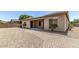 Landscaped backyard with a patio and gravel at 5612 W Alyssa Ln, Phoenix, AZ 85083