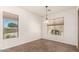 Simple dining room with tile floors and window views at 5612 W Alyssa Ln, Phoenix, AZ 85083