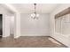 Bright dining room with chandelier and tile floors at 5612 W Alyssa Ln, Phoenix, AZ 85083