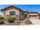 One-story home with stone accents and a landscaped front yard at 5612 W Alyssa Ln, Phoenix, AZ 85083