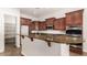 Kitchen with granite countertops and dark wood cabinets at 5612 W Alyssa Ln, Phoenix, AZ 85083