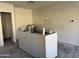 Unfinished kitchen with island and cabinets at 5612 W Alyssa Ln, Phoenix, AZ 85083