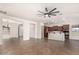 Spacious living room with tile floors and a ceiling fan at 5612 W Alyssa Ln, Phoenix, AZ 85083