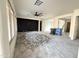 Large living room featuring black accent wall and ready for new flooring at 5612 W Alyssa Ln, Phoenix, AZ 85083