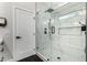 Modern bathroom with frameless glass shower, hexagon tile, and built-in bench at 6809 E Gelding Dr, Scottsdale, AZ 85254