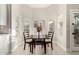 Charming dining area with a modern table set and natural lighting from the large windows at 6809 E Gelding Dr, Scottsdale, AZ 85254