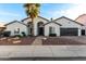 Charming single-story home with a well-manicured yard and inviting curb appeal under a blue sky at 6809 E Gelding Dr, Scottsdale, AZ 85254