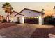 Elegant single-story home featuring a two-car garage and lush landscaping at 6809 E Gelding Dr, Scottsdale, AZ 85254