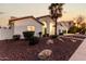 Attractive single-story home boasting neat landscaping and a welcoming arched entryway at 6809 E Gelding Dr, Scottsdale, AZ 85254