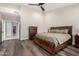 Spacious main bedroom boasts wood floors, ceiling fan, and en-suite access at 6809 E Gelding Dr, Scottsdale, AZ 85254