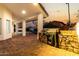 Outdoor kitchen area with a covered patio, built-in grill, and a view of the pool at 6809 E Gelding Dr, Scottsdale, AZ 85254