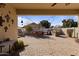 Expansive backyard patio featuring a built-in grilling area, string lights, and a spacious outdoor dining area at 8171 W Beaubien Dr, Peoria, AZ 85382