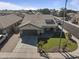 A single-Gathering home shows meticulous landscaping with a two car garage at 8171 W Beaubien Dr, Peoria, AZ 85382