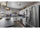 Modern kitchen with stainless steel appliances, white cabinets, and a stylish backsplash for the home chef at 8171 W Beaubien Dr, Peoria, AZ 85382