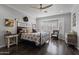 Cozy main bedroom with a bay window, ceiling fan, and warm, inviting decor for a peaceful night's rest at 8171 W Beaubien Dr, Peoria, AZ 85382