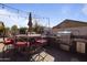 An outdoor kitchen is shown with a built-in grill and bar seating at 8171 W Beaubien Dr, Peoria, AZ 85382