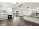 Bright living room featuring a cozy fireplace, modern flooring, and sliding glass doors for natural light at 9705 E Mountain View Rd # 1050, Scottsdale, AZ 85258