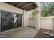 Covered patio with sliding glass door, offering a shaded outdoor space at 9705 E Mountain View Rd # 1050, Scottsdale, AZ 85258