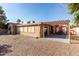 The backyard features desert landscaping, providing a low-maintenance outdoor area with a patio at 9725 E Navajo Pl, Sun Lakes, AZ 85248