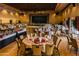 Elegant ballroom with tables set for an event, featuring a stage, chandeliers, and hardwood floors at 9725 E Navajo Pl, Sun Lakes, AZ 85248