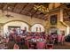 Elegant dining area with beautifully set tables, offering a welcoming atmosphere for residents and guests at 9725 E Navajo Pl, Sun Lakes, AZ 85248