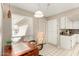 Bright kitchen area with a cozy desk nook, white cabinets, and tiled flooring at 9725 E Navajo Pl, Sun Lakes, AZ 85248