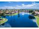 Scenic view of homes around a pond with a fountain, set within the community landscape at 9725 E Navajo Pl, Sun Lakes, AZ 85248