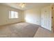 Spacious bedroom with carpeted floors and large window at 10330 W Thunderbird Blvd # A304, Sun City, AZ 85351