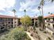 Courtyard view of apartment complex with lush landscaping and a gazebo at 10330 W Thunderbird Blvd # A304, Sun City, AZ 85351